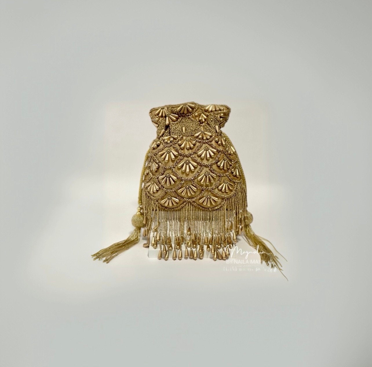 BARIELY | Gold Potli Bag with bead work and gold embellishment |